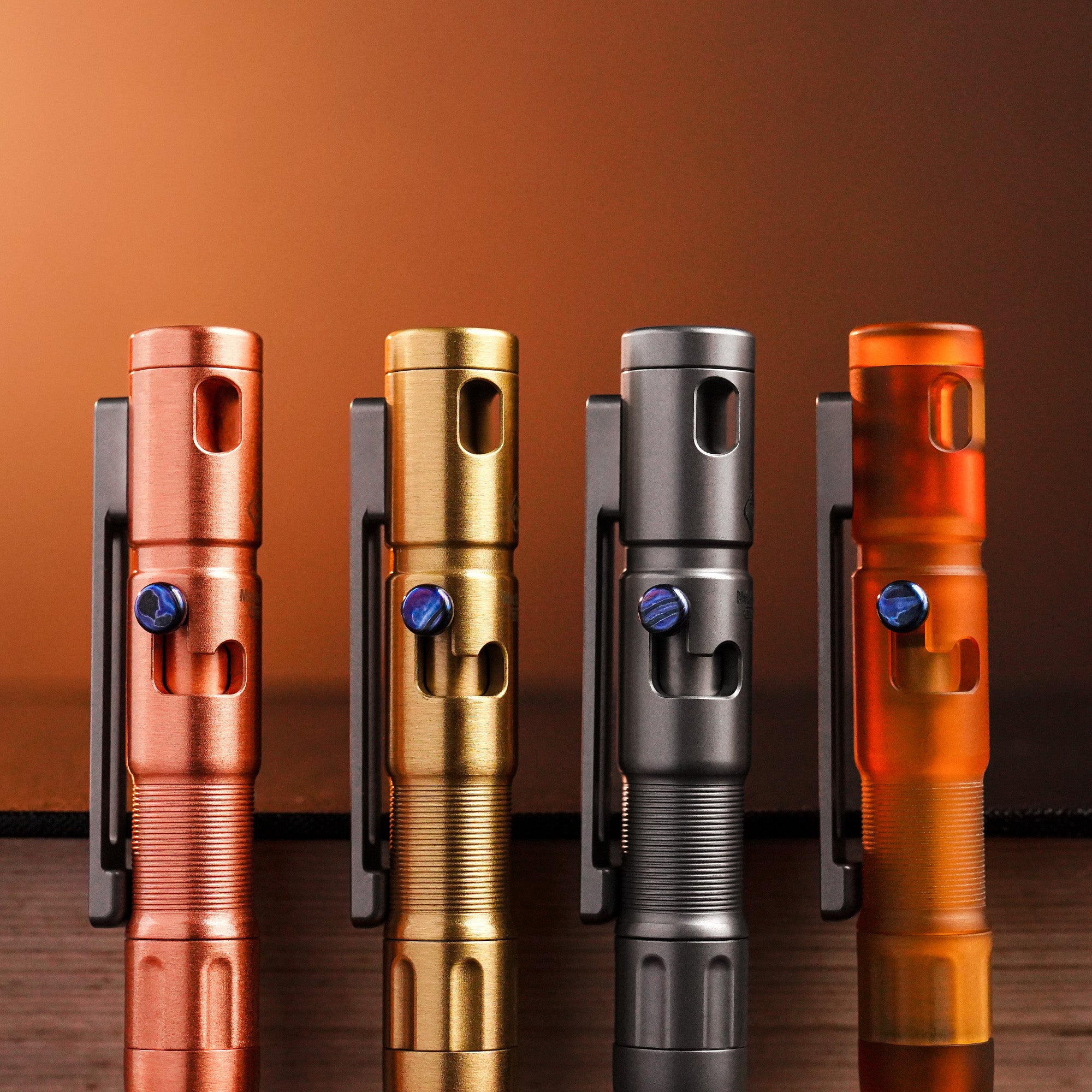 TPX11 pens in copper, brass, titanium, and PEI fitted with zirconium Damascus bolts.