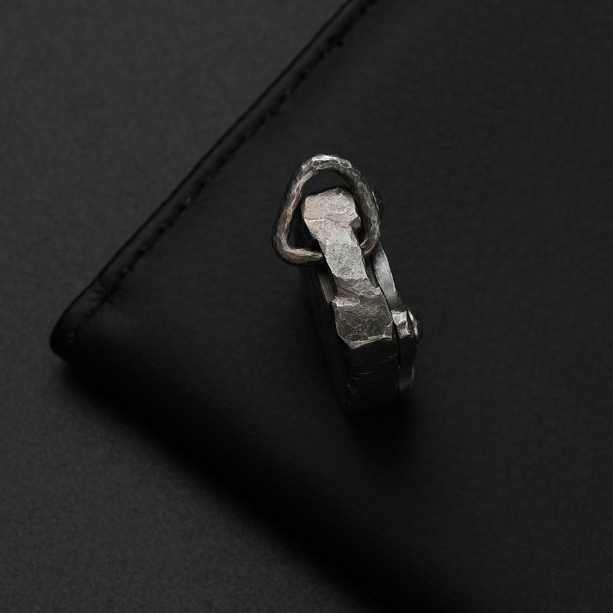 MecArmy CMP2-HC hand-carved titanium EDC compass showing the sculpted attachment ring and textured edge details