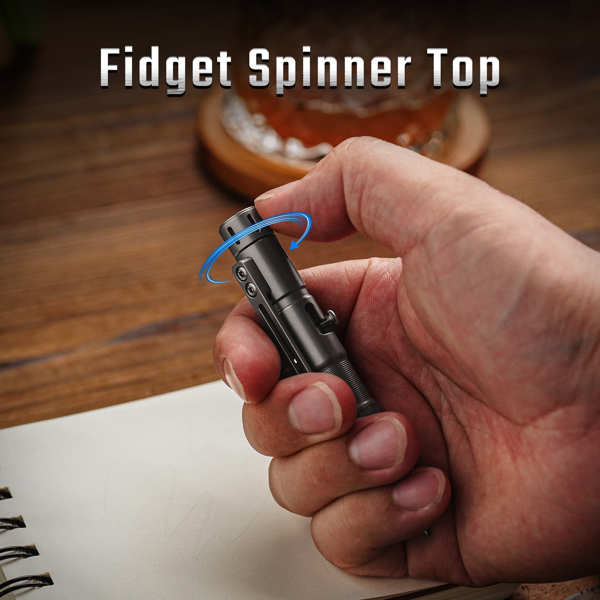 TPX11 fidget spinner top rotating under the thumb during handheld use.