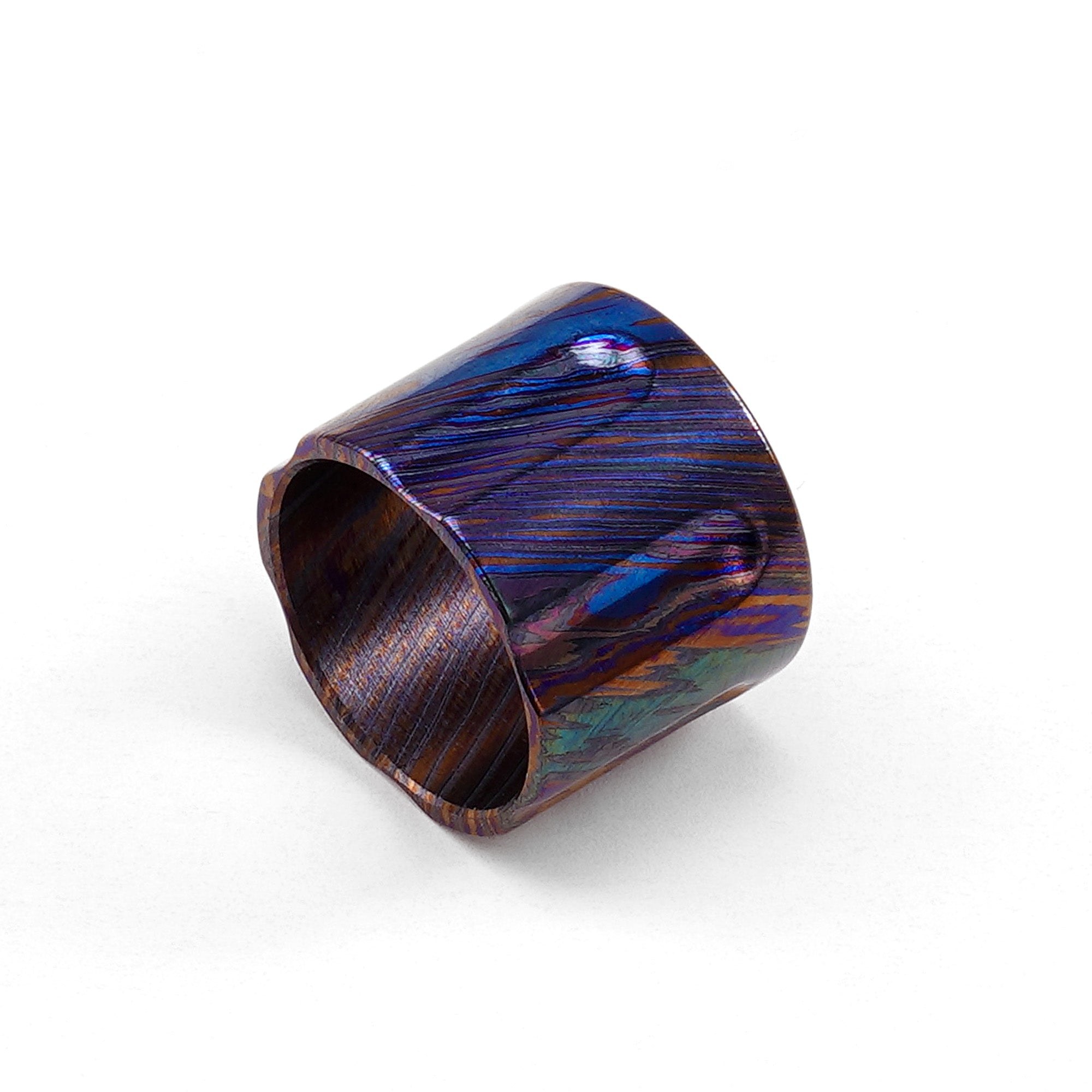 zirconium Damascus replacement grip with multicolor layered pattern.