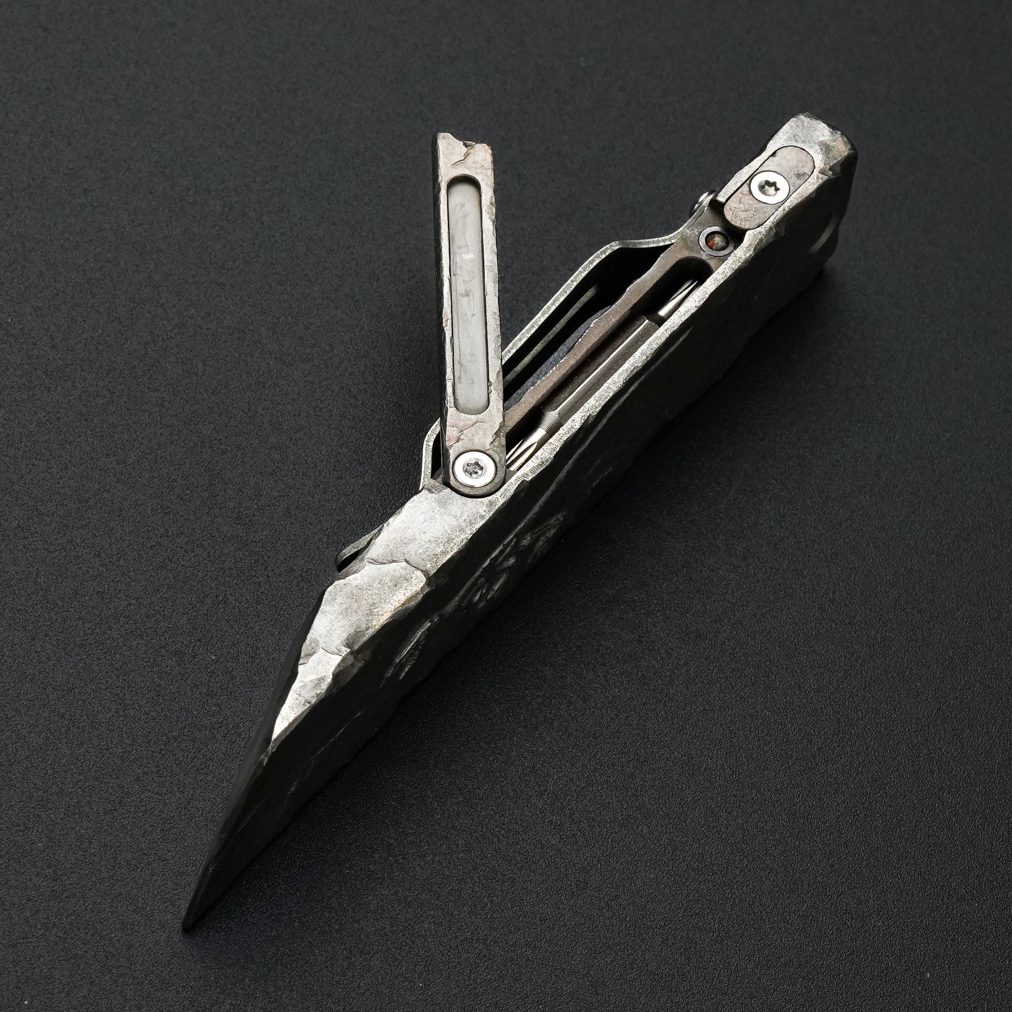 MecArmy RL4-HC hand-carved titanium EDC pry bar dinosaur skull edition shown open with the integrated tool compartment