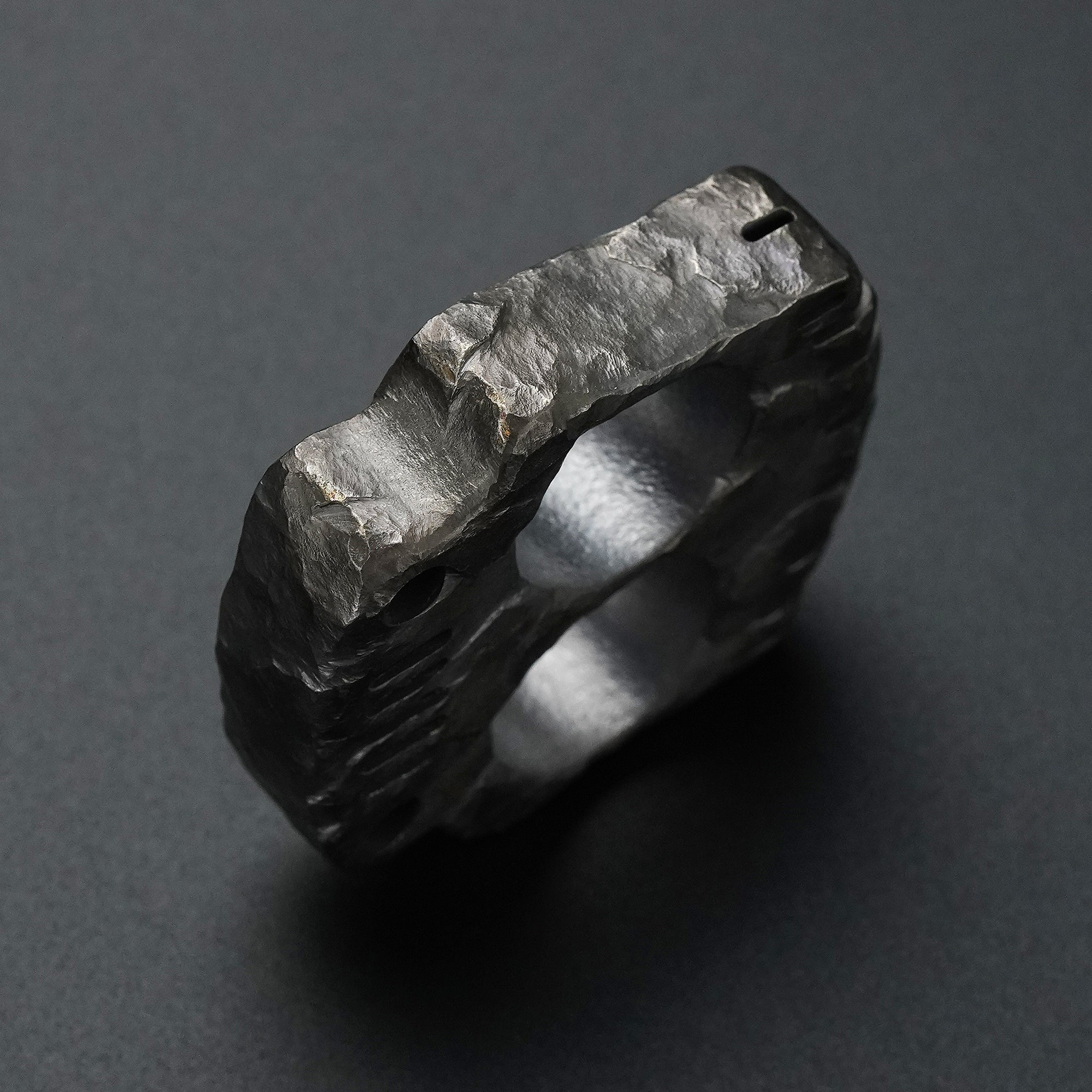 Side detail of the MecArmy TKF-HC hand-carved titanium EDC knuckle featuring a unique hand-sculpted finish