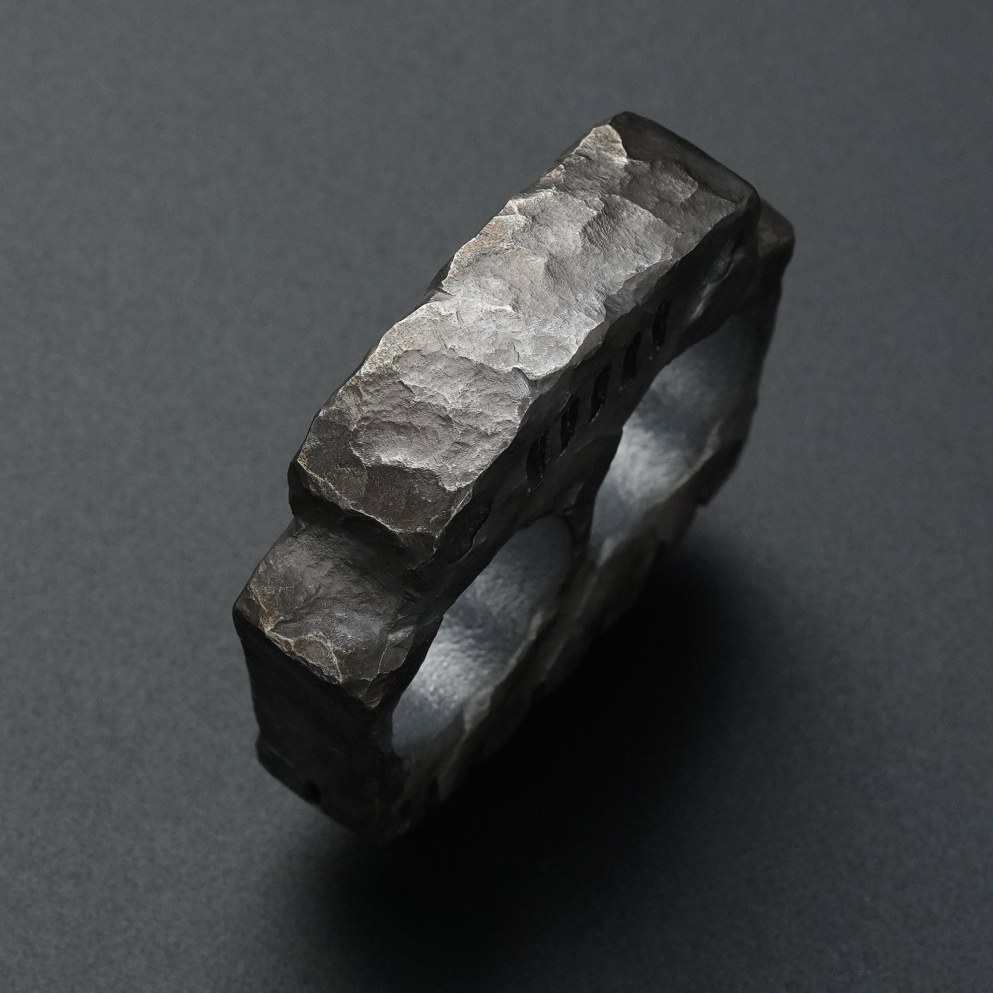 Top detail of the MecArmy TKF-HC hand-carved titanium EDC knuckle showing individually sculpted titanium facets